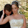 bride and groom by the river